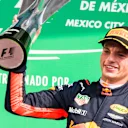 Autodromo Hermanos Rodriguez, Mexico City, Mexico.\nSunday 29 October 2017.\nMax Verstappen, Red Bull Racing, raises his winner’s trophy on the podium.\nWorld Copyright: Sam Bloxham/LAT Images \nref: Digital Image _W6I1348