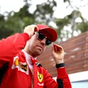 MELBOURNE, AUSTRALIA - MARCH 12: Sebastian Vettel of Germany and Ferrari looks on in the Paddock during previews ahead of the F1 Grand Prix of Australia at Melbourne Grand Prix Circuit on March 12, 2020 in Melbourne, Australia. (Photo by Mark Thompson/Getty Images)