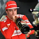 Second placed finisher Fernando Alonso (ESP) Ferrari drinks champagne On the podium.\nFormula One World Championship, Rd11, Hungarian Grand Prix, Race Day, Hungaroring, Hungary. Sunday 27 July 2014.\n\nBEST IMAGE