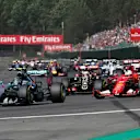 Nico Rosberg (GER) Mercedes AMG F1 W06 and Sebastian Vettel (GER) Ferrari SF15-T at the start of the race at Formula One World Championship, Rd11, Belgian Grand Prix, Race, Spa Francorchamps, Belgium, Sunday 23 August 2015. &copy; Sutton Motorsport Images