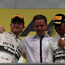 Nico Rosberg (GER) Mercedes AMG F1 and race winner Lewis Hamilton (GBR) Mercedes AMG F1 celebrate on the podium at Formula One World Championship, Rd11, Belgian Grand Prix, Race, Spa Francorchamps, Belgium, Sunday 23 August 2015. &copy; Sutton Motorsport Images