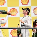 Race winner Lewis Hamilton (GBR) Mercedes AMG F1,  Nico Rosberg (GER) Mercedes AMG F1 and Romain Grosjean (FRA) Lotus F1 celebrate on the podium with the champagne at Formula One World Championship, Rd11, Belgian Grand Prix, Race, Spa Francorchamps, Belgium, Sunday 23 August 2015. &copy; Sutton Motorsport Images