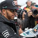 Lewis Hamilton (GBR) Mercedes AMG F1 signs autographs for the fans at Formula One World Championship, Rd1, Australian Grand Prix, Practice, Albert Park, Melbourne, Australia, Friday 18 March 2016. &copy; Sutton Motorsport Images