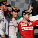 (L to R): Lewis Hamilton (GBR) Mercedes AMG F1, Race winner Nico Rosberg (GER) Mercedes AMG F1 and Sebastian Vettel (GER) Ferrari celebrate on the podium at Formula One World Championship, Rd1, Australian Grand Prix, Race, Albert Park, Melbourne, Australia, Sunday 20 March 2016. &copy; Sutton Motorsport Images