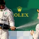 Lewis Hamilton (GBR) Mercedes AMG F1 and Nico Rosberg (GER) Mercedes AMG F1 celebrate on the podium with the champagne at Formula One World Championship, Rd1, Australian Grand Prix, Race, Albert Park, Melbourne, Australia, Sunday 20 March 2016. &copy; Sutton Motorsport Images