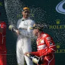 Sebastian Vettel (GER) Ferrari and Lewis Hamilton (GBR) Mercedes AMG F1 celebrate on the podium with the champagne at Formula One World Championship, Australian Grand Prix, Race, Melbourne, Australia, Sunday 26 March 2017. © Sutton Motorsport Images