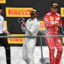 Lewis Hamilton (GBR) Mercedes AMG F1 celebrates on the podium with Sebastian Vettel (GER) Ferrari, Andy Shovlin (GBR) Mercedes AMG F1 Engineer and the champagne at Formula One World Championship, Rd12, Belgian Grand Prix, Race, Spa Francorchamps, Belgium, Sunday 27 August 2017. © Sutton Images