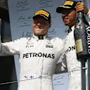 Valtteri Bottas (FIN) Mercedes AMG F1 and Lewis Hamilton (GBR) Mercedes AMG F1 celebrate on the podium with the champagne at Formula One World Championship, Rd7, Canadian Grand Prix, Race, Montreal, Canada, Sunday 11 June 2017.
