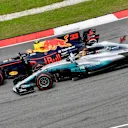 Max Verstappen (NED) Red Bull Racing RB13 passes Lewis Hamilton (GBR) Mercedes-Benz F1 W08 Hybrid for the lead at Formula One World Championship, Rd15, Malaysian Grand Prix, Race, Sepang, Malaysia, Sunday 1 October 2017. © Sutton Images