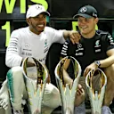 Race winner Lewis Hamilton (GBR) Mercedes AMG F1 and Valtteri Bottas (FIN) Mercedes AMG F1 celebrate with the team at Formula One World Championship, Rd14, Singapore Grand Prix, Race, Marina Bay Street Circuit, Singapore, Sunday 17 September 2017. © Mirko Stange/Sutton Images