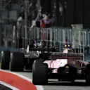 Romain Grosjean (FRA) Haas VF-17 and Esteban Ocon (FRA) Force India VJM10 pit at Formula One World Championship, Rd14, Singapore Grand Prix, Race, Marina Bay Street Circuit, Singapore, Sunday 17 September 2017. © Kym Illman/Sutton Images