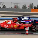 Sebastian Vettel (GER) Ferrari SF70-H and Carlos Sainz jr (ESP) Scuderia Toro Rosso STR12 at Formula One Testing, Day Two, Bahrain International Circuit, Sakhir, Bahrain, Wednesday 19 April 2017. © Sutton Motorsport Images
