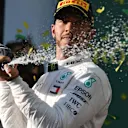 Lewis Hamilton (GBR) Mercedes-AMG F1 celebrates on the podium with the champagne at Formula One World Championship, Rd1, Australian Grand Prix, Race, Melbourne, Australia, Sunday 25 March 2018. © Mark Sutton/Sutton Images