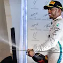 Lewis Hamilton (GBR) Mercedes-AMGlhp celebrates on the podium at Formula One World Championship, Rd2, Bahrain Grand Prix, Race, Bahrain International Circuit, Sakhir, Bahrain, Sunday 8 April 2018. © Jerry Andre/Sutton Images