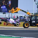 The crashed car of Brendon Hartley (NZL) Scuderia Toro Rosso STR13 is recovered in FP3 at Formula One World Championship, Rd10, British Grand Prix, Qualifying, Silverstone, England, Saturday 7 July 2018. © Simon Galloway/Sutton Images