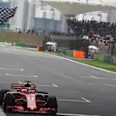 Pole sitter Sebastian Vettel (GER) Ferrari SF-71H takes the chequered flag at the end of Qualifying at Formula One World Championship, Rd3, Chinese Grand Prix, Qualifying, Shanghai, China, Saturday 14 April 2018. © Mark Sutton/Sutton Images