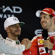 World Champion Nico Rosberg (GER) Mercedes AMG F1 celebrates on the podium with Sebastian Vettel