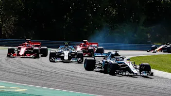 HUNGARORING, HUNGARY - JULY 29: Lewis Hamilton, Mercedes AMG F1 W09, leads Valtteri Bottas,