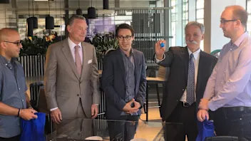 Chase Carey, Formula 1 Chairman and CEO, (second right) and Sean Bratches, Managing Director,