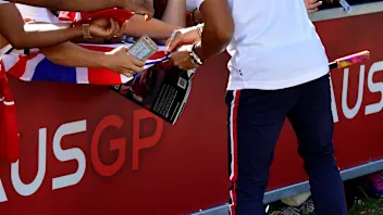 Lewis Hamilton (GBR) Mercedes-AMG F1 on a scooter signs autographs for the fans at Formula One