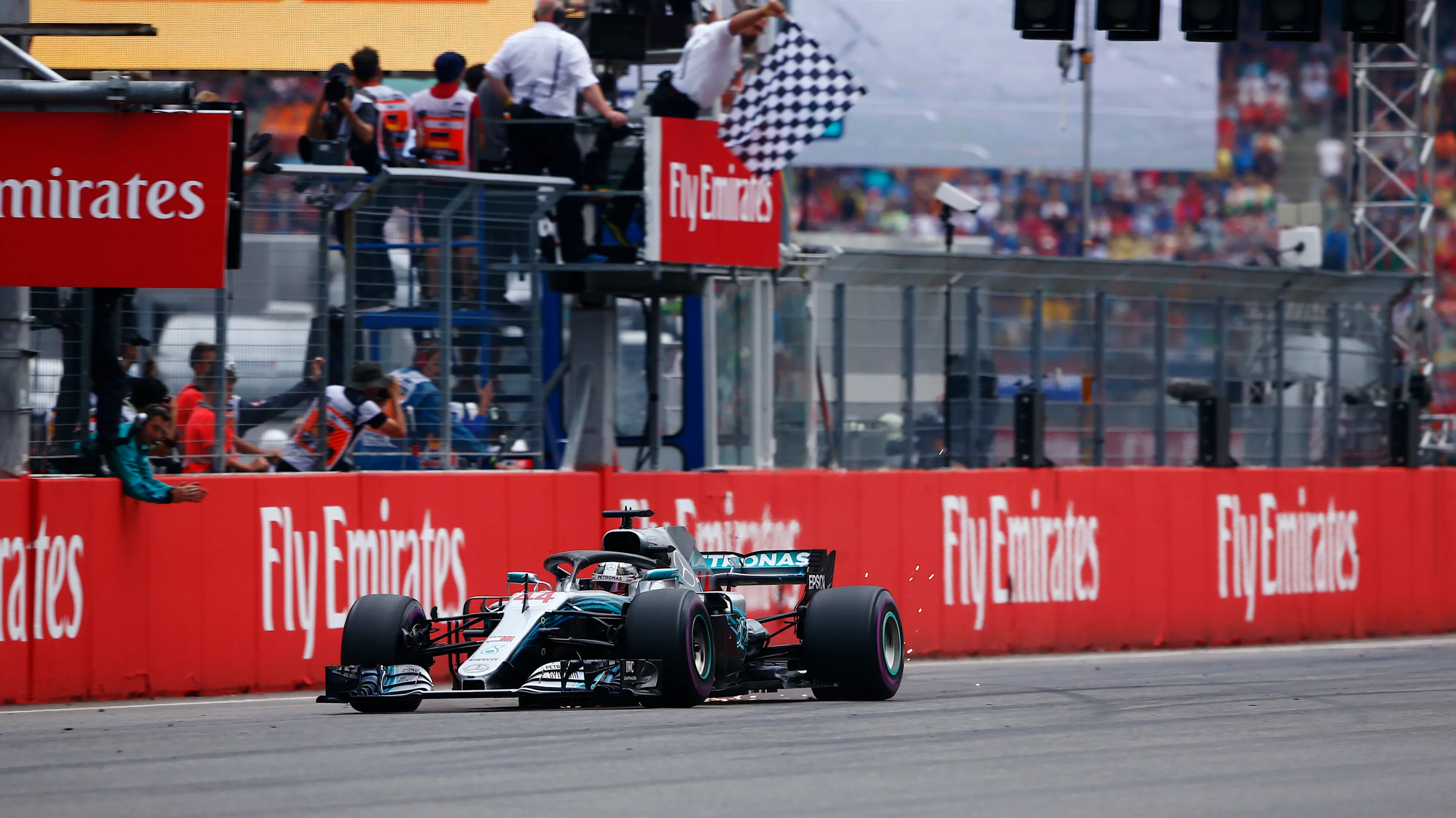 HOCKENHEIMRING, GERMANY - JULY 22: Lewis Hamilton, Mercedes AMG F1 W09, strikes sparks as he takes