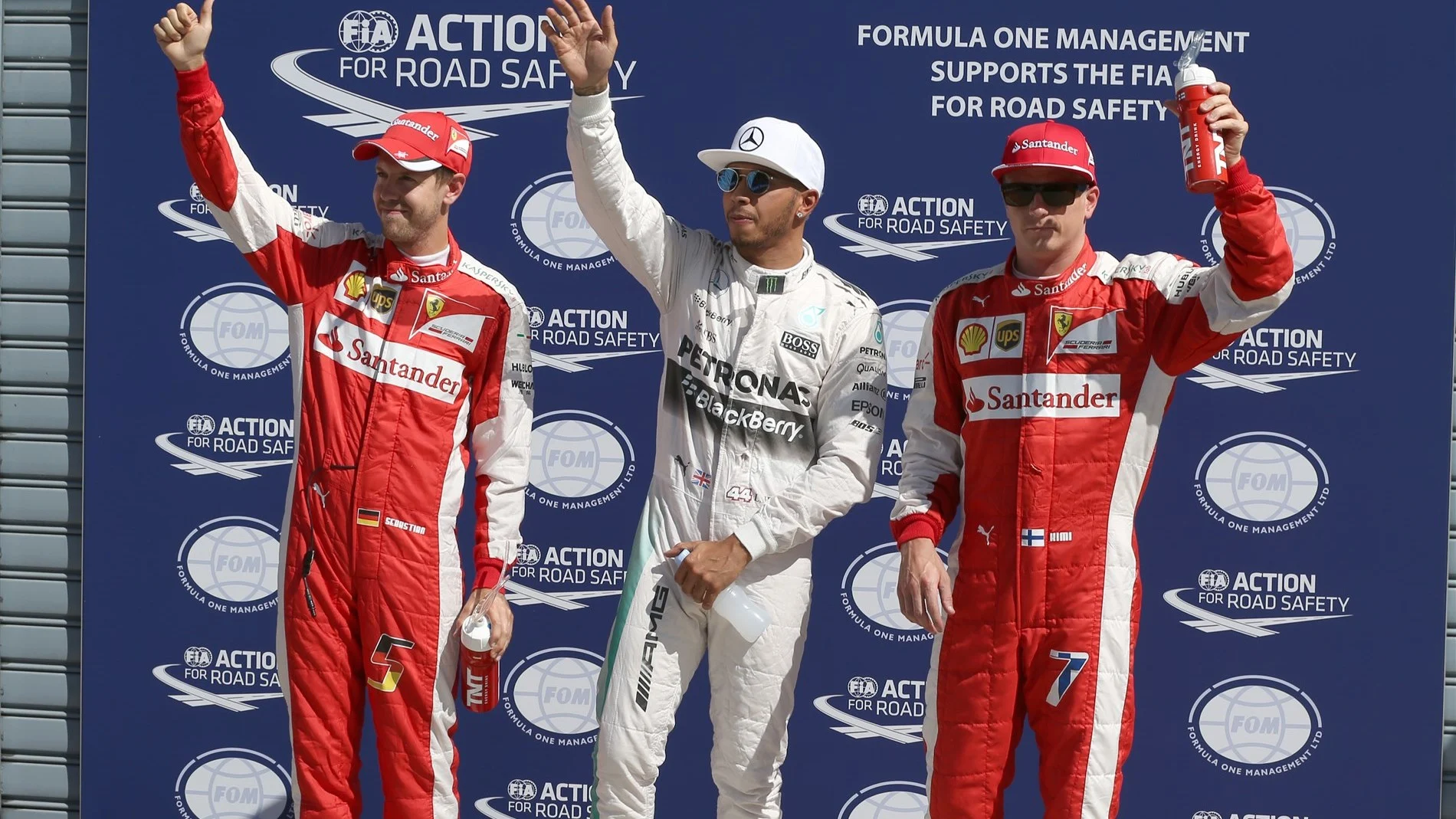 Pole sitter Lewis Hamilton (GBR) Mercedes AMG F1, Sebastian Vettel (GER) Ferrari and Kimi Raikkonen (FIN) Ferrari celebrate in parc ferme at Formula One World Championship, Rd12, Italian Grand Prix, Qualifying, Monza, Italy, Saturday 5 September 2015. &copy; Sutton Motorsport Images