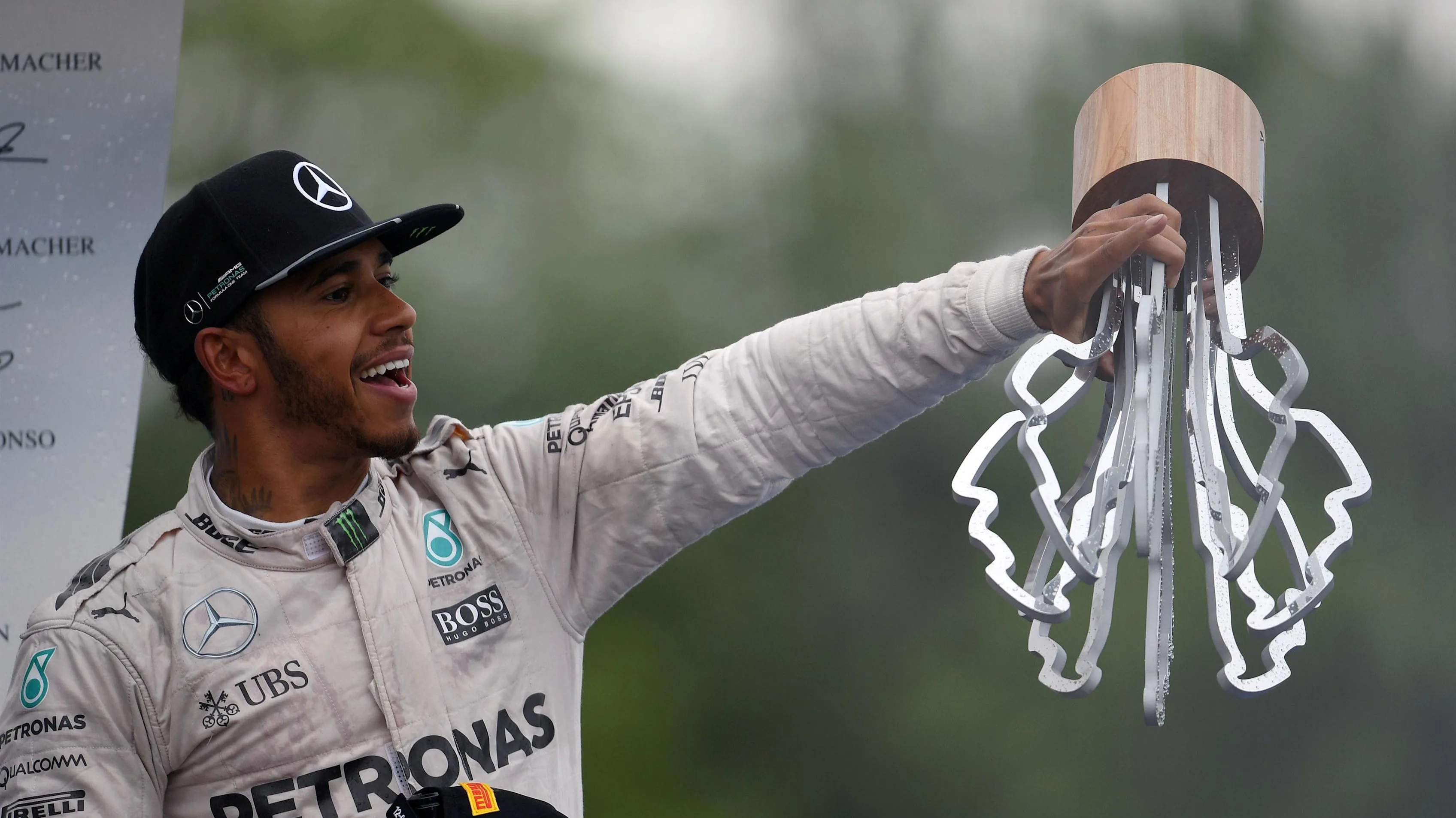 Race winner Lewis Hamilton (GBR) Mercedes AMG F1 celebrates on the podium with the trophy at