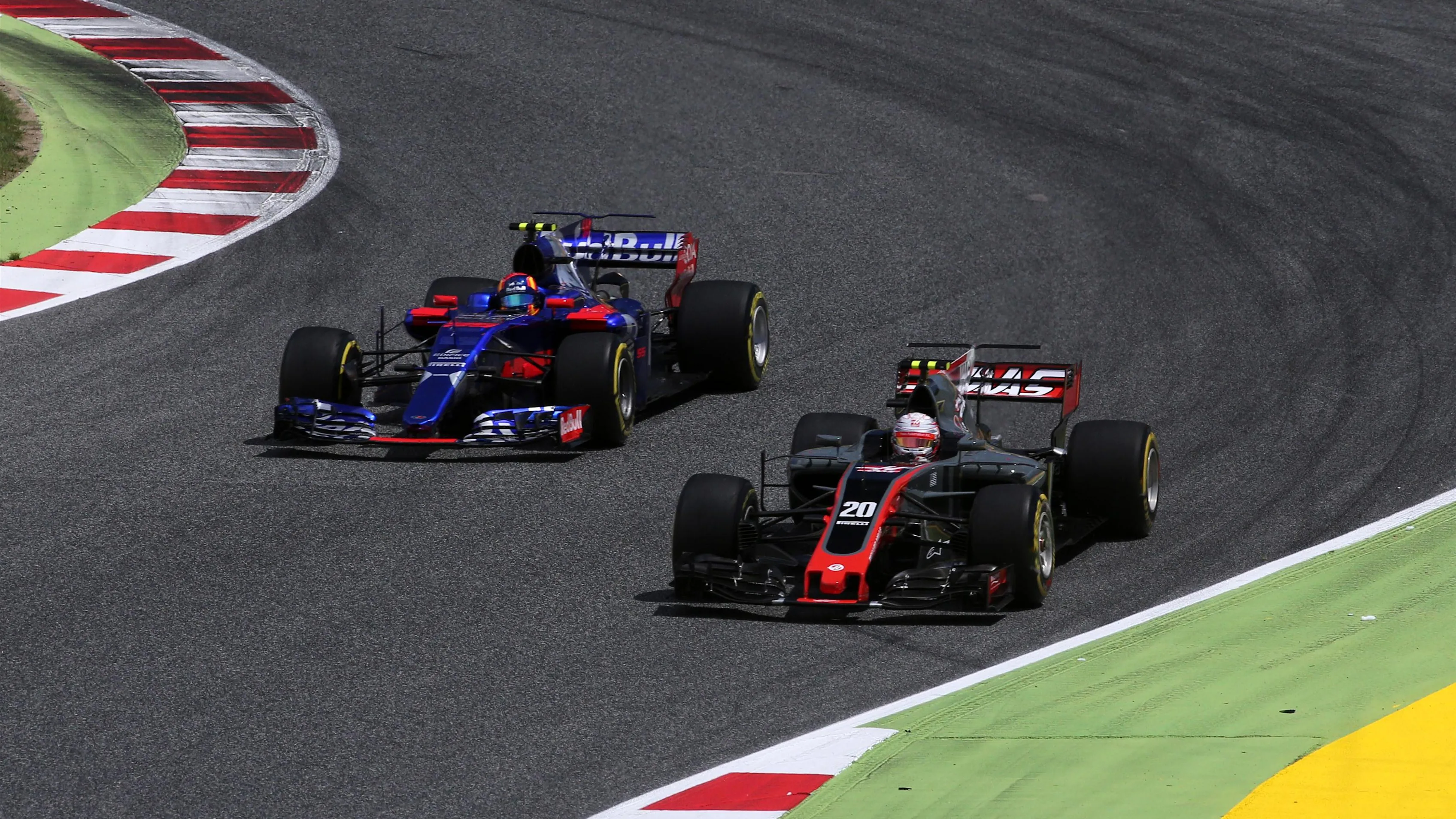 Carlos Sainz (ESP) Scuderia Toro Rosso STR12 and Kevin Magnussen (DEN) Haas VF-17 battle at Formula One World Championship, Rd5, Spanish Grand Prix, Race, Barcelona, Spain, Sunday 14 May 2017. © Sutton Motorsport Images