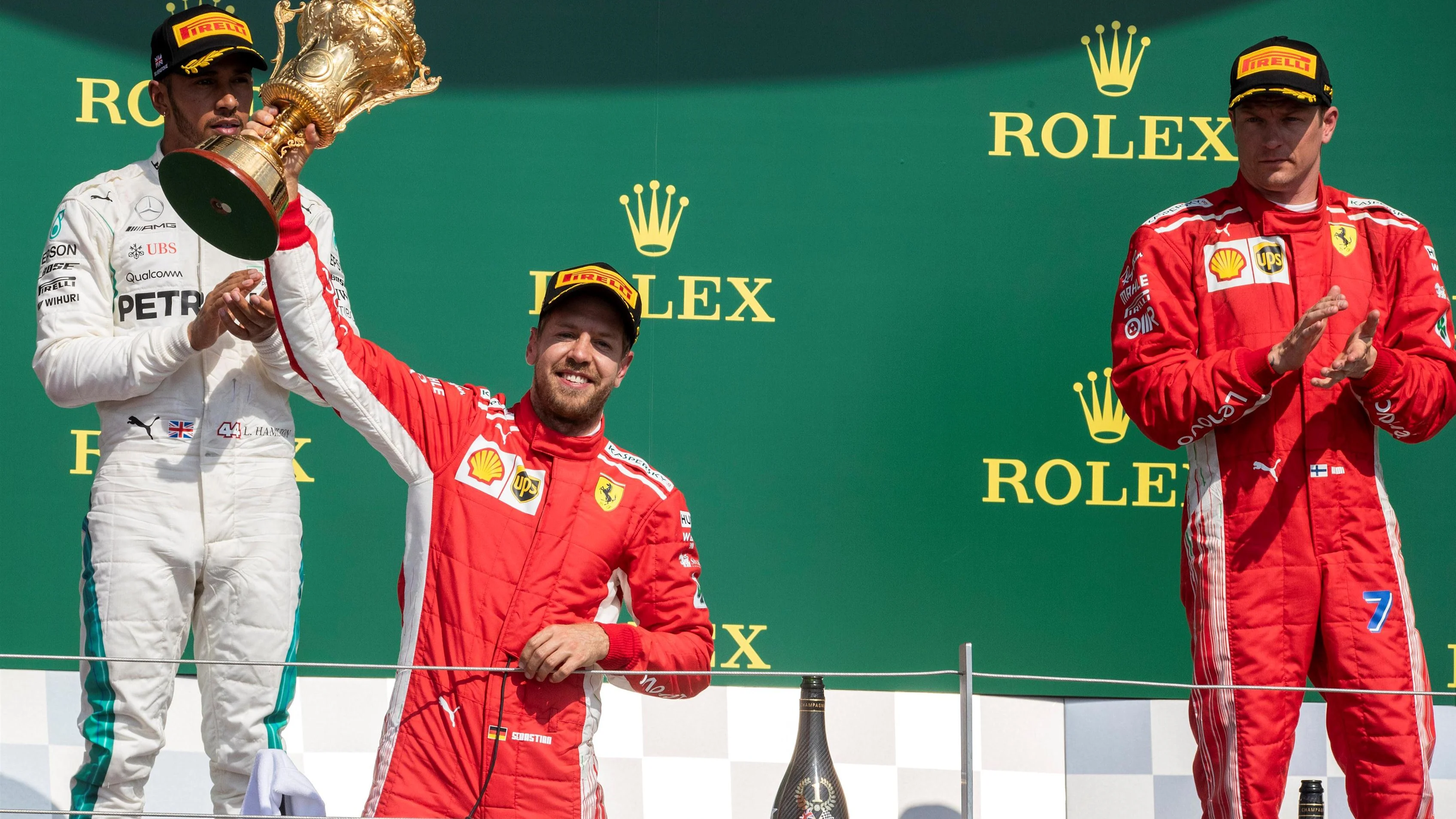 Sebastian Vettel (GER) Ferrari celebrates on the podium with the trophy at Formula One World