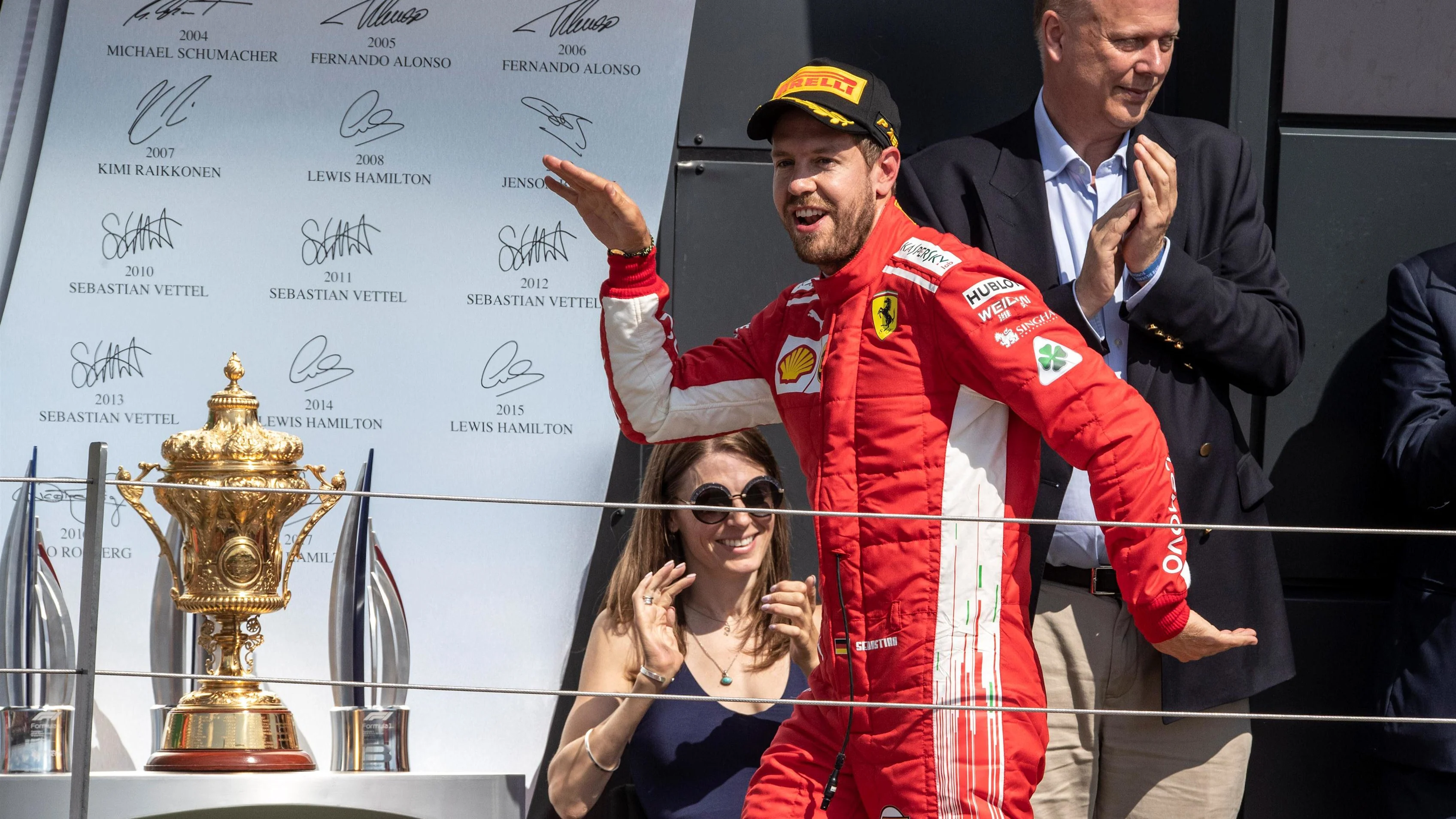 Race winner Sebastian Vettel (GER) Ferrari celebrates on the podium at Formula One World