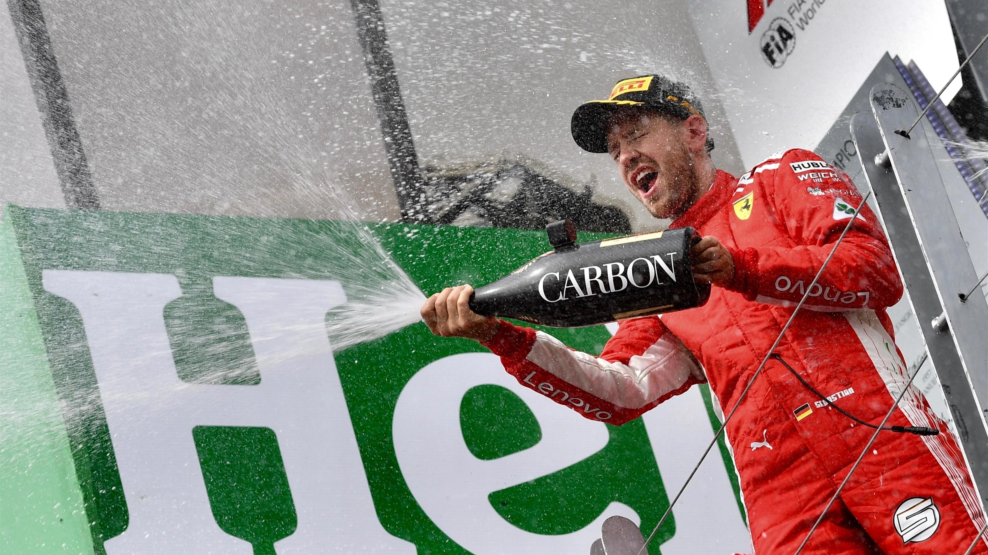 Race winner Sebastian Vettel (GER) Ferrari celebrates with the champagne on the podium at Formula One World Championship, Rd7, Canadian Grand Prix, Race, Montreal, Canada, Sunday10 June 2018. © Jerry Andre/Sutton Images