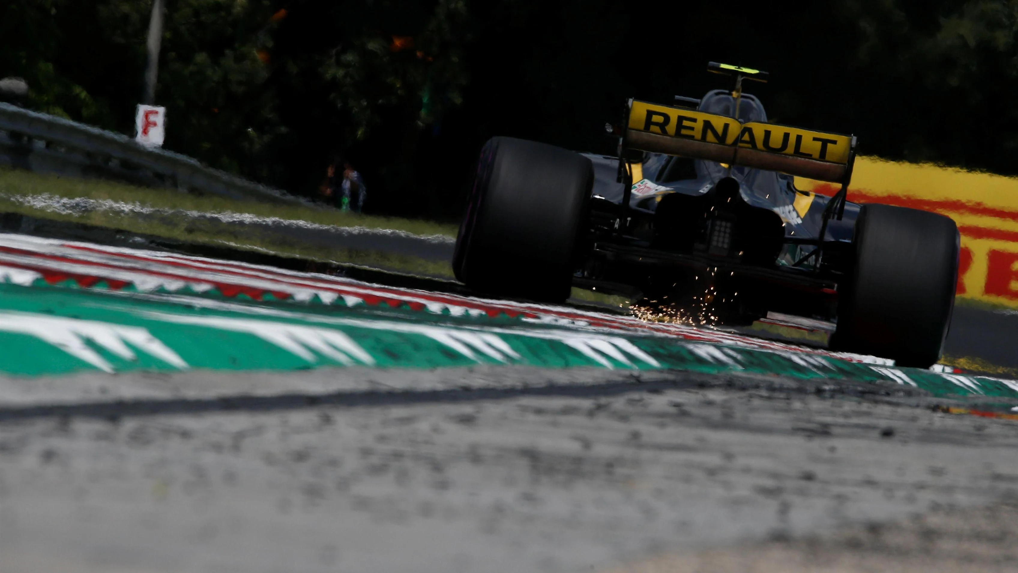 Carlos Sainz jr (ESP) Renault Sport F1 Team RS18 sparks at Formula One World Championship, Rd12,