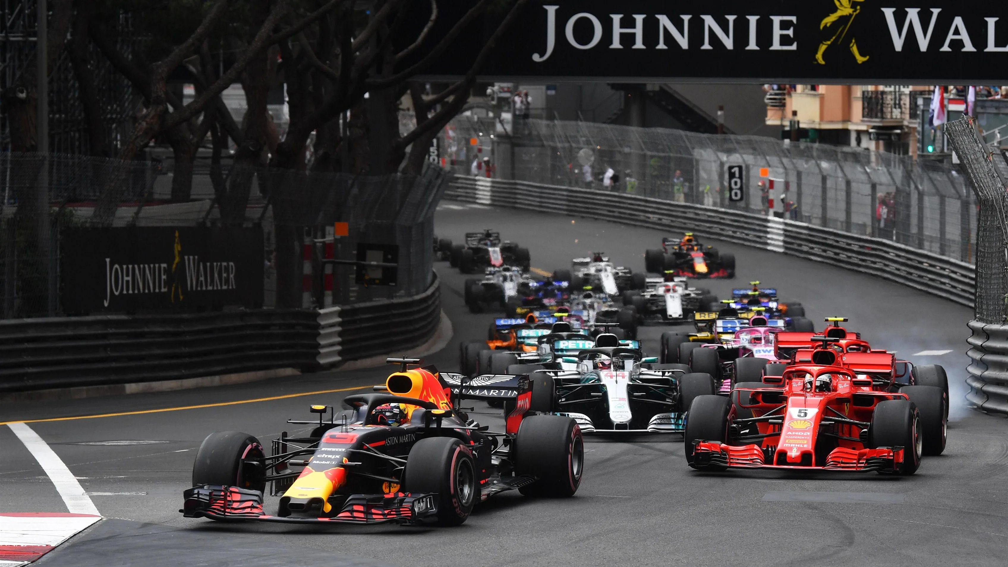 Daniel Ricciardo (AUS) Red Bull Racing RB14 leads Sebastian Vettel (GER) Ferrari SF-71H at the start of the race at Formula One World Championship, Rd6, Monaco Grand Prix, Race, Monte-Carlo, Monaco, Sunday 27 May 2018. © Mark Sutton/Sutton Images