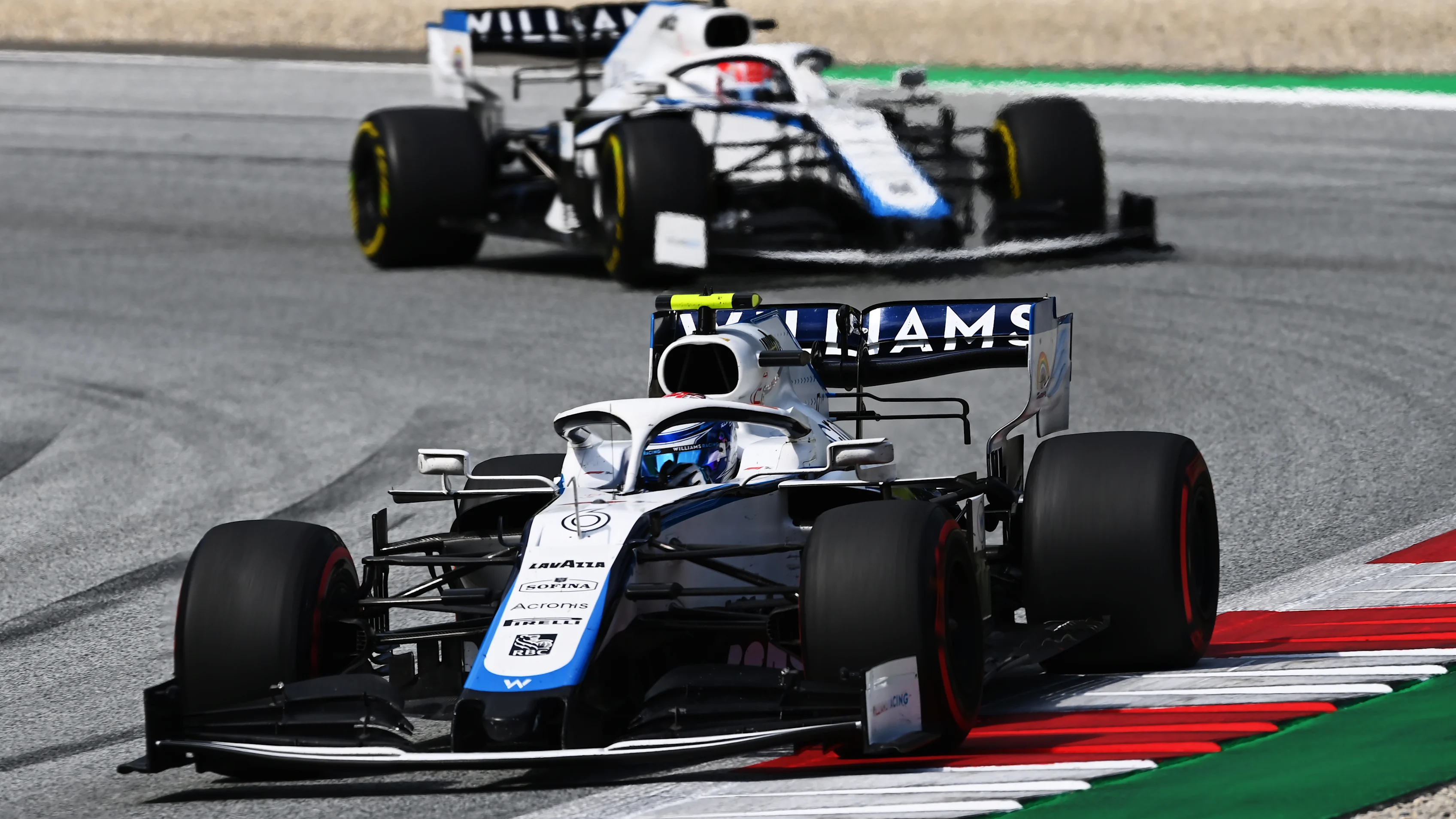 SPIELBERG, AUSTRIA - JULY 12: Nicholas Latifi of Canada driving the (6) Williams Racing FW43 Mercedes leads George Russell of Great Britain driving the (63) Williams Racing FW43 Mercedes  during the Formula One Grand Prix of Styria at Red Bull Ring on July 12, 2020 in Spielberg, Austria. (Photo by Clive Mason - Formula 1/Formula 1 via Getty Images)