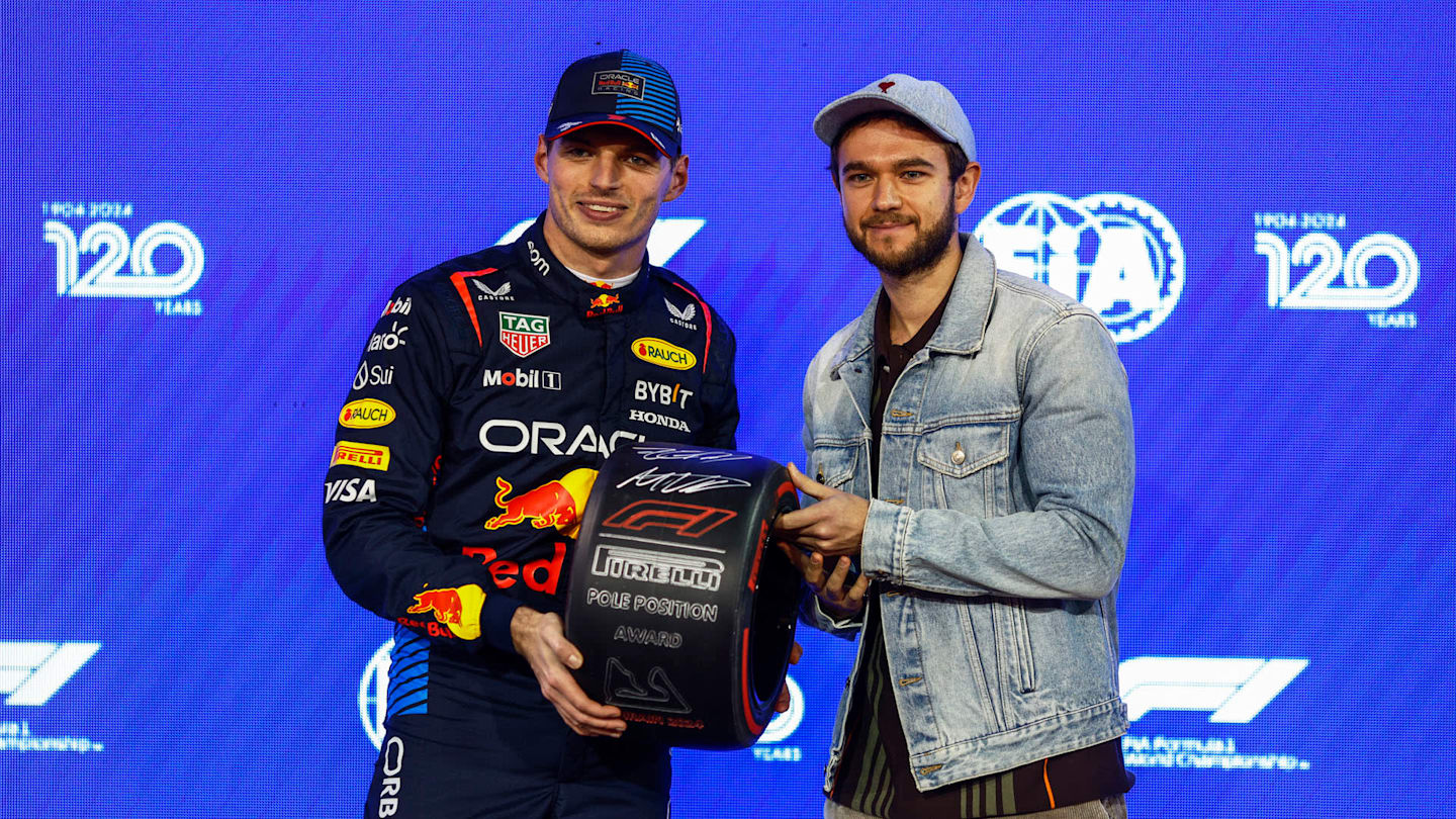 BAHRAIN INTERNATIONAL CIRCUIT, BAHRAIN - MARCH 01: Max Verstappen, Red Bull Racing, receives his